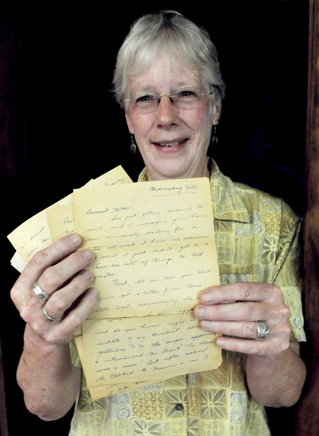 Ann MacMichael holds nine pages of a letter she recently received that was written and mailed in 1931.   AP-Yonhap