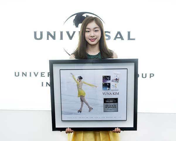 Kim Yuna poses with her Platinum-selling records to be hung on the wall of Universal Music Korea’s Hall of Fame.   Universal Music