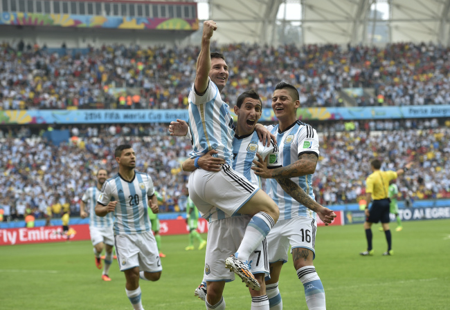 Argentina’s Lionel Messi is lifted into the air after scoring against Nigeria at the World Cup.   AP-Yonhap