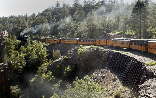 The Durango and Silverton Narrow Gauge Railroad heads down the grade on the Highline above Animas Canyon from Silverton to Durango, Colorado, June 5. (Los Angeles Times/MCT)