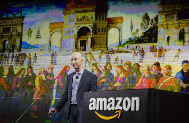 Jeff Bezos, CEO of Amazon.com Inc., unveils the Fire Phone during an event at Fremont Studios in Seattle on June 18.   Bloomberg