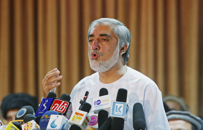 Afghan presidential candidate Abdullah Abdullah speaks during a press conference at his residence in Kabul on Sunday.   AP-Yonhap