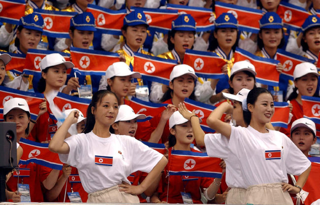 North Korean cheerers root for their team during the 2002 Asian Games in Busan.   Yonhap