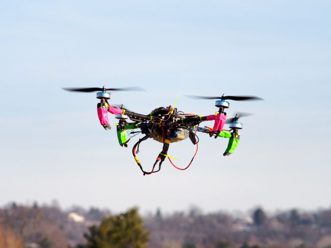 A small remote-controlled drone hovers in the sky during a meet-up of the DC Area Drone User Group in Middletown, Maryland.   AFP-Yonhap