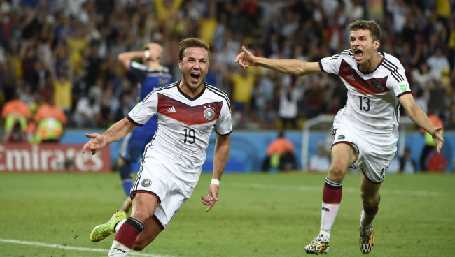 Germany’s Mario Goetze (left) celebrates his goal against Argentina at the World Cup on Sunday.   Xinhua-Yonhap