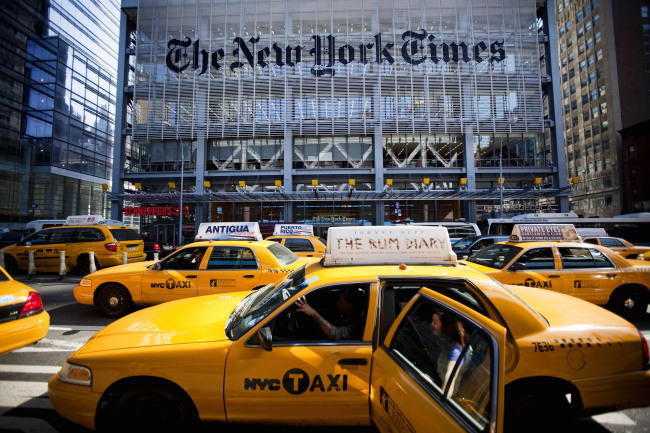 Taxi cabs drive past the New York Times Co. headquarters in New York. (Bloomberg)
Taxi cabs drive past the New York Times Co. headquarters in New York. (Bloomberg)