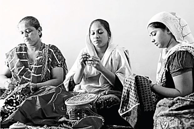 Women work at Colours Of India.   The Star