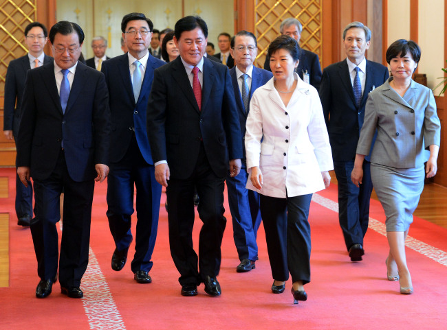 President Park Geun-hye walks with newly appointed top officials after a conferment ceremony at Cheong Wa Dae on Friday.   Park Hyun-koo/The Korea Herald