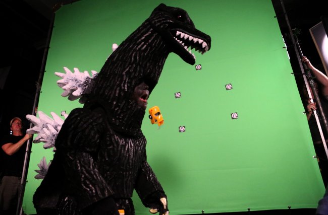 Maddex, 5, spits out half of a toy car while he plays the lead role on the film set of “Madzilla” as it is produced by a professional film crew at Big Deahl Productions in Chicago on July 13.   Chicago Tribune/MCT
