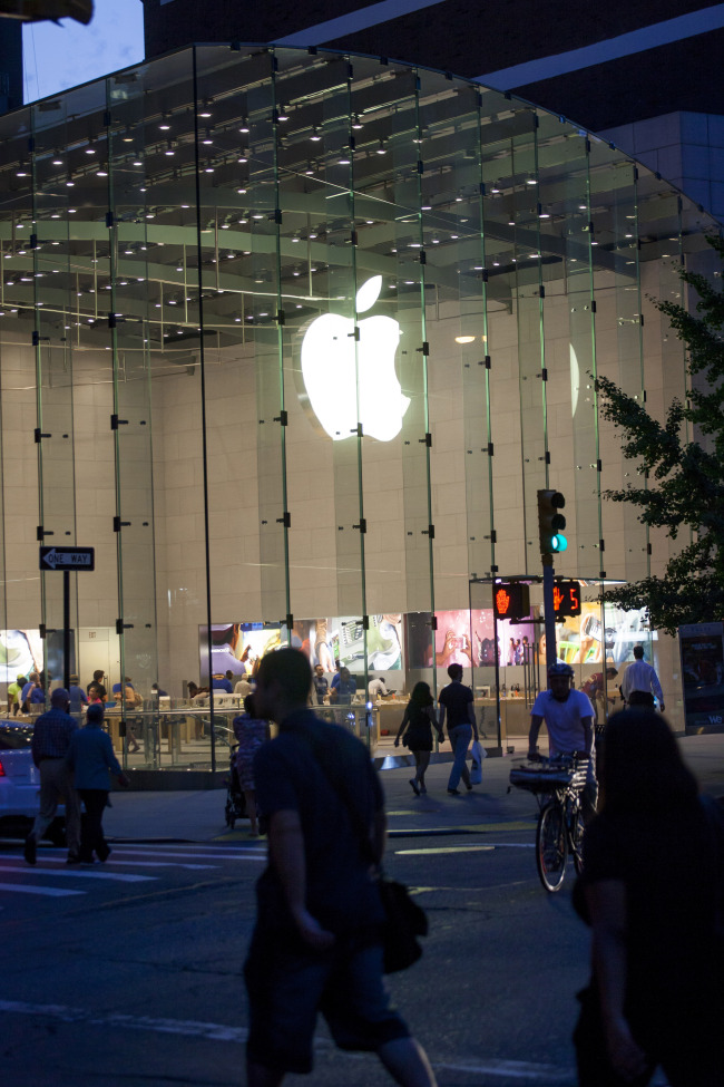 Pedestrians pass in front of the Apple Inc. store on Manhattan's Upper West Side in New York, U.S., on Sunday, July 20, 2014. Apple Inc. is expected to release earnings data on July 22. Photographer: Michael Nagle/Bloomberg
Pedestrians pass an Apple store in New York.   Bloomberg
Pedestrians pass an Apple store in New York.   Bloomberg