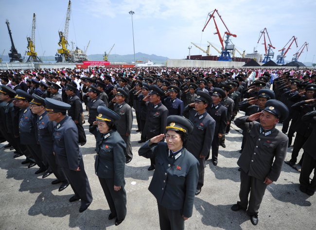 Military officers attend the launching ceremony of a Russian-North Korean coal transshipment terminal in the North Korean port of Rajin. The terminal, built with the involvement of the Russian Railways, is a pilot project for the reconstruction of the North Korean and South Korean railways and linking them up with the Trans-Siberian Railway.   Yonhap