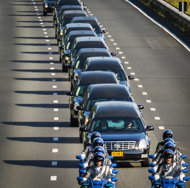 A column of funeral hearses drives near Boxtel after leaving the airbase in Eindhoven to Hilversum, the Netherlands, Wednesday.   EPA-Yonhap
