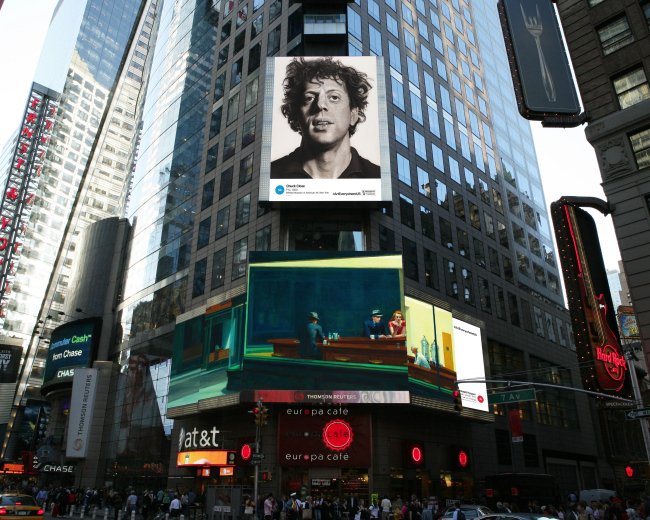 A display in New York’s Times Square features Chuck Close’s “Phil” (top) and Edward Hopper’s “Nighthawks.”   AP-Yonhap