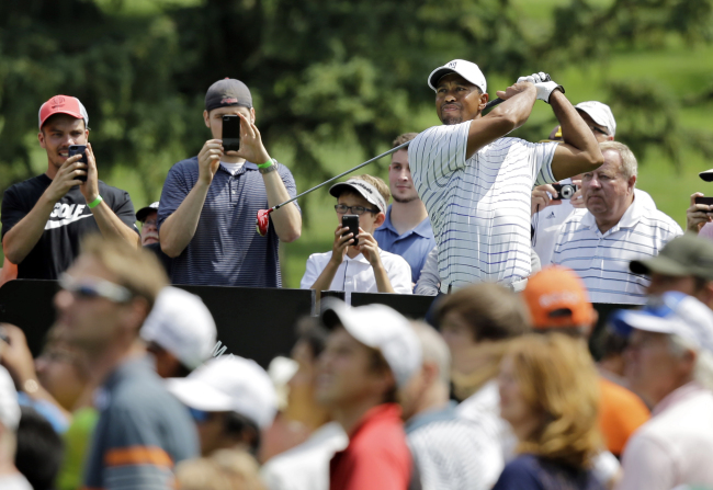 Tiger Woods watches his drive on the third hole during a practice round ahead of the Bridgestone Invitational on Wednesday.   AP-Yonhap