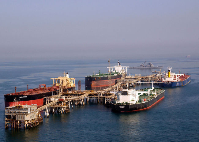 Oil tankers approach drilling and processing facilities at the Zubair oil field in southern Iraq.   KOGAS