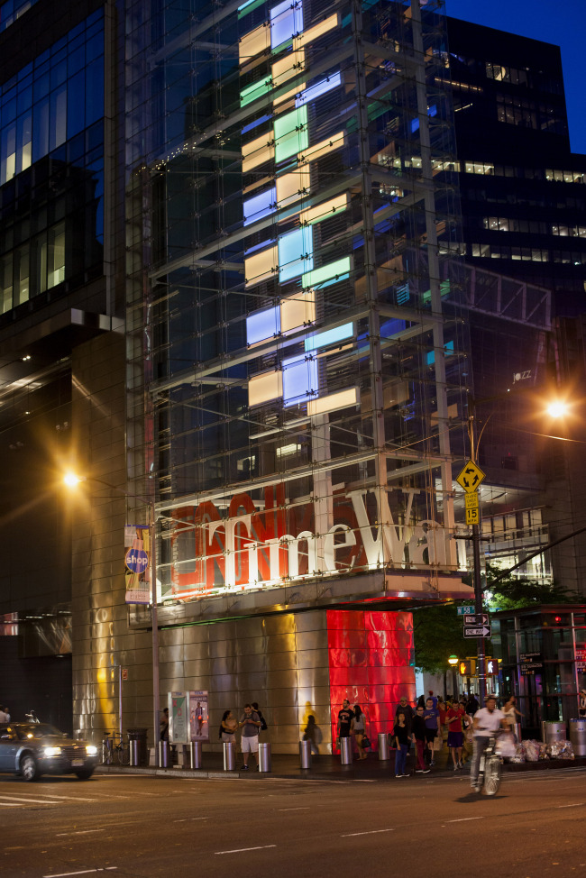 Pedestrians pass the Time Warner Center in New York.   Bloomberg