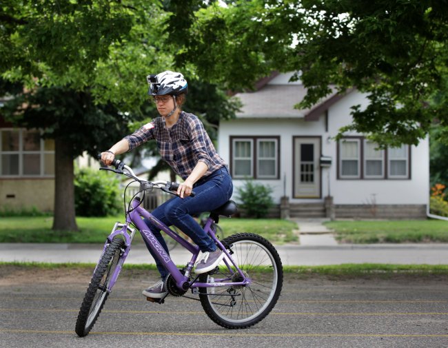 Asya Kosygina pedals through the first lesson of a Learn-to-Ride bike class at Matthews Park in Minneapolis on July 19.   Minneapolis Star Tribune/MCT
