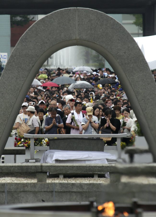 People offer prayers for victims killed by the world’s first atomic bombing of a city, during World War II in 1945, in Hiroshima, Japan, Wednesday.   EPA-Yonhap