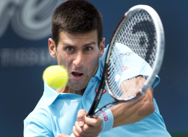 Novak Djokovic returns against Gael Monfils at the Rogers Cup on Wednesday.    AP-Yonhap
