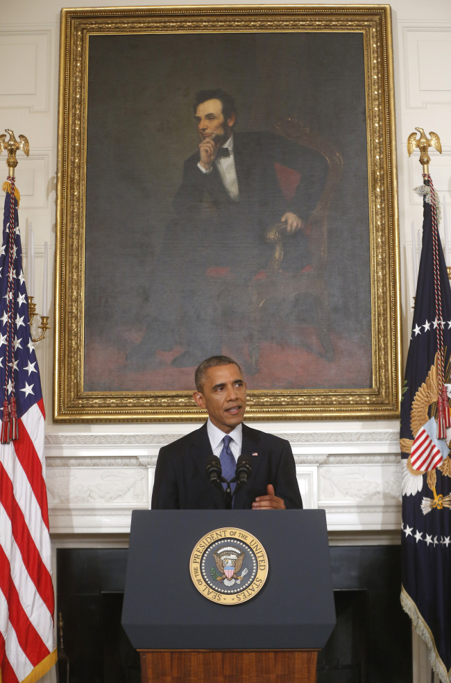 President Barack Obama speaks about the situation in Iraq in the State Dining Room at the White House in Washington, Thursday. Obama says he has authorized the U.S. military to launch targeted airstrikes if Islamic militants advance toward American personnel in northern Iraq. (AP)