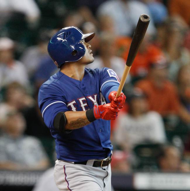 The Texas Rangers’ Choo Shin-soo hits his 11th home run of the season against the Houston Astros on Sunday.   AFP-Yonhap