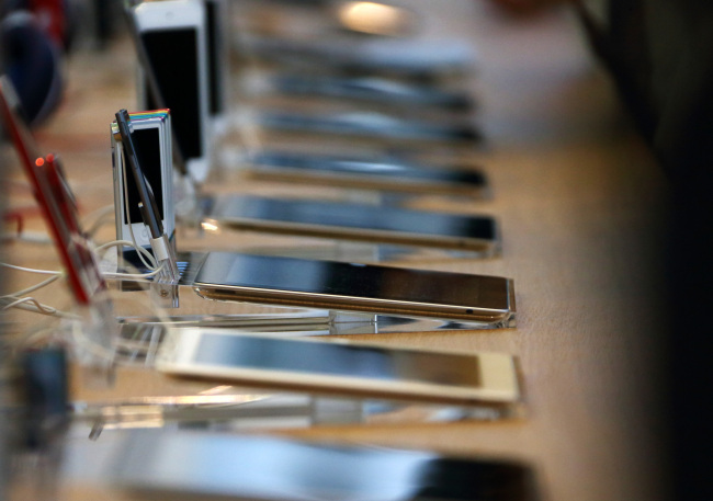 Apple iPads are displayed inside the company’s Omotesando store in Tokyo.   Bloomberg