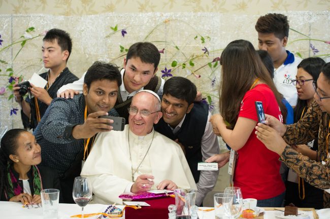 Pope Francis poses for a selfie as he meets young people at the Major Seminar in Daejeon, Friday.   AFP-Yonhap