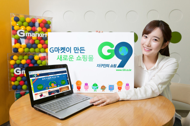 An employee at Gmarket introduces the G9, the firm’s new
e-commerce platform. (eBay)