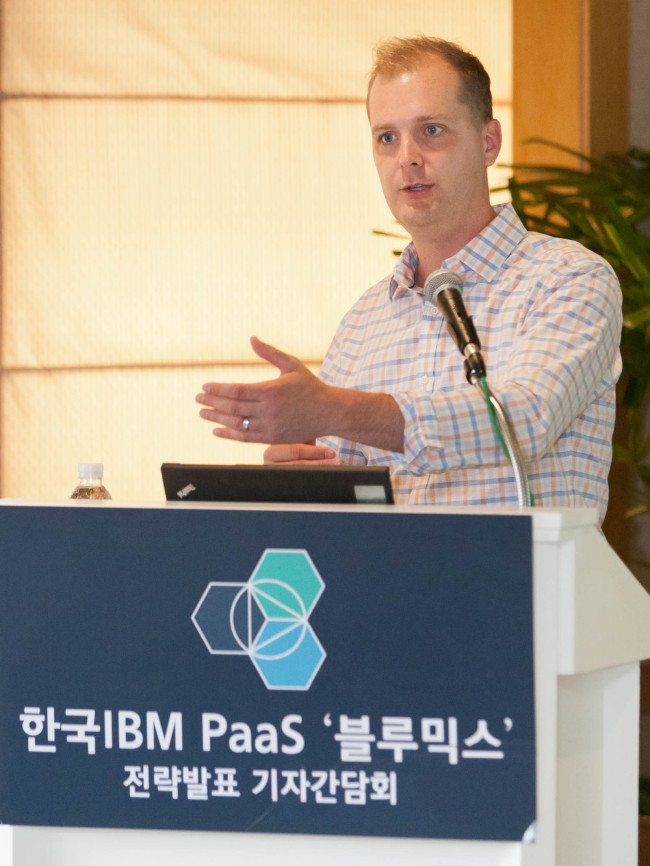 Adam Kocoloski, chief technology officer of Cloudant, an affiliate of IBM, speaks to the press about IBM’s newly launched cloud computing platform called Bluemix in Seoul on Thursday.   IBM