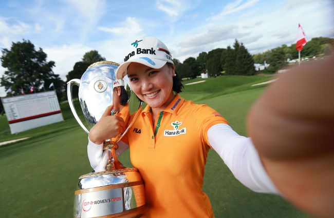 So Yeon Ryu of South Korea imitates a 'selfie' as she celebrates her two stroke victory during the fourth round of the LPGA Canadian Pacific Women's Open at the London Hunt and Country Club on Sunday in London, Ontario, Canada. (AFP)