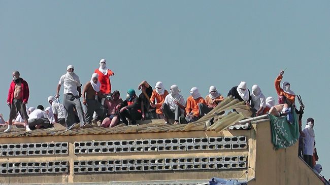 Inmates take hostages at a prison in Parana, Brazil, Sunday.   AFP-Yonhap