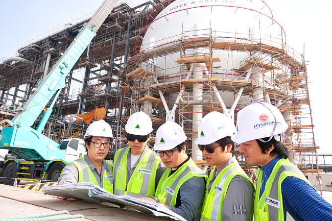 Hyundai Engineering & Construction employees work at the construction site of a gas plant in Habshan, southwestern Abu Dhabi, United Arab Emirates.   Hyundai E&C