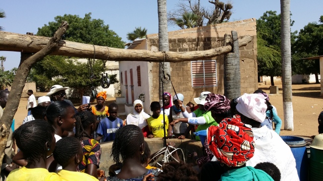 Residents of the Senegalese town of Soune Serere draw water from a well built by the Korea International Cooperation Agency in January.   KOICA