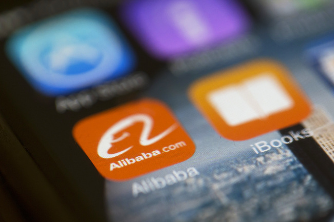 The Alibaba Group Holding app logo is displayed on an iPhone in Hong Kong.   Bloomberg