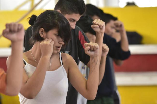 Any Hurtado (left) takes a part in boxing training in a gym in downtown Quito.   AFP