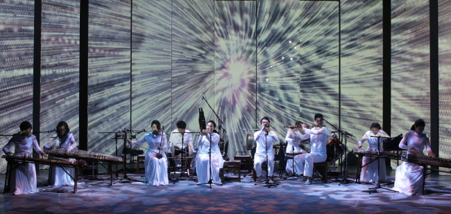 Musicians perform during the “Stellar Whisper” concert, presenting modern interpretations of traditional tunes with 3-D visual art.   Namsangol Hanok Village