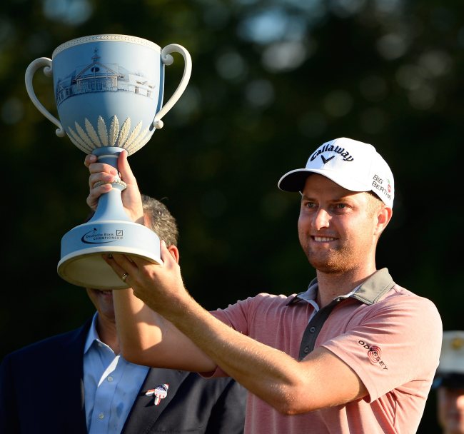 Chris Kirk poses with the winner’s trophy on Monday.   EPA-Yonhap