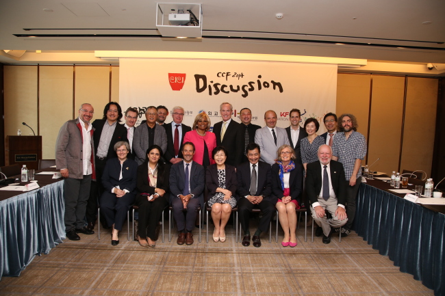 Corea Image Communication Institute President Choi Jung-wha (center, front row) poses with the participants of the annual Culture Communication Forum at the Westin Chosun Seoul hotel in Seoul on Tuesday.   Corea Image Communication Institute