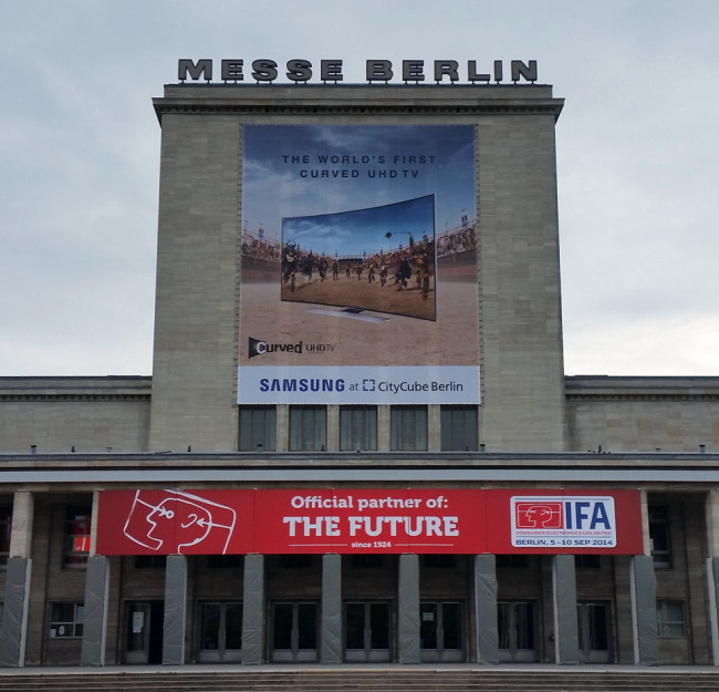 Samsung Electronics displays an advertisement featuring the world’s first curved UHD TV at the 2014 IFA in Berlin.   Samsung Electronics