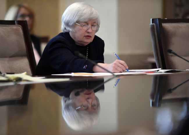 Reserve Chair Janet Yellen takes notes during a Board of Governors meeting on Wednesday.    AP-Yonhap
