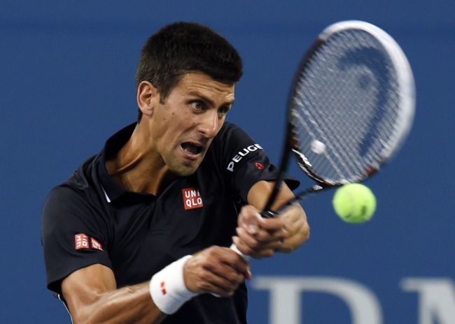 Novak Djokovic returns a shot against Andy Murray on Wednesday.   AFP-Yonhap