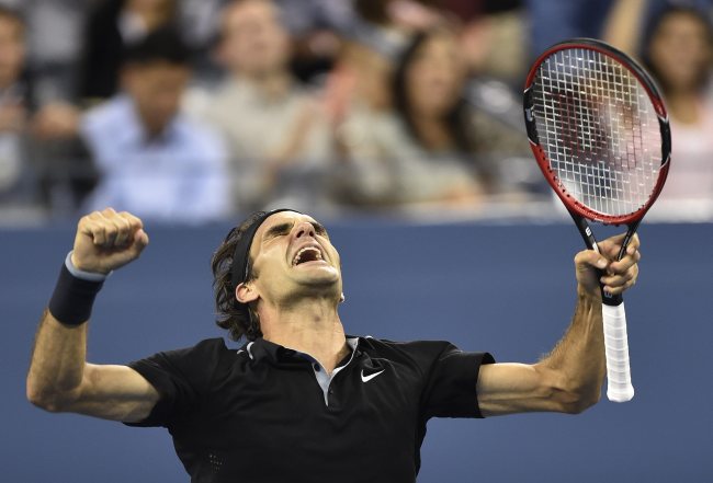 Roger Federer reacts after defeating Gael Monfils during their quarterfinals round match of the 2014 U.S. Open Tennis Championship at the USTA National Tennis Center in Flushing Meadows, New York, Thursday.   EPA-Yonhap