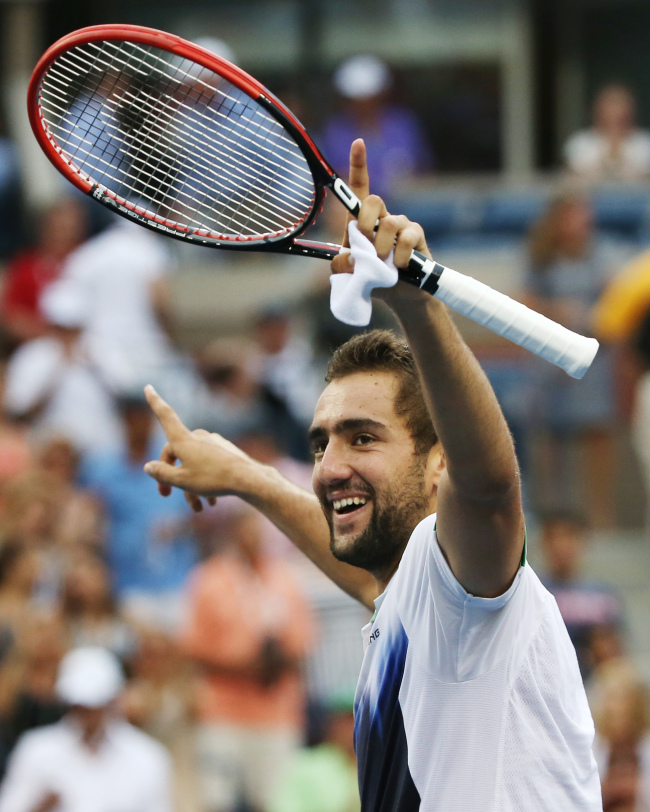 Marin Cilic, of Croatia, reacts defeating Roger Federer, of Switzerland, during the semifinals of the 2014 U.S. Open tennis tournament, Saturday, Sept. 6, 2014, in New York. (AP