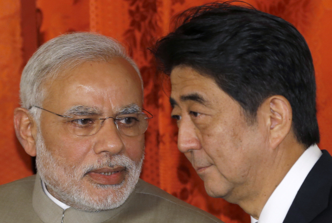 India’s Prime Minister Narendra Modi (left) and Japan’s Prime Minister Shinzo Abe.   Bloomberg