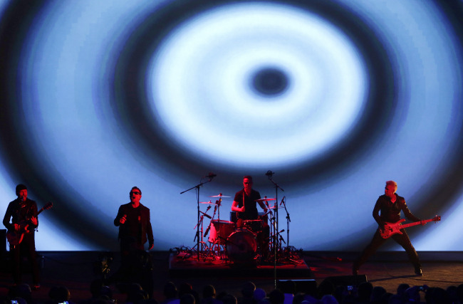 U2 performs during Apple Inc.’s product announcement at Flint Center in Cupertino, California, on Tuesday.   Bloomberg