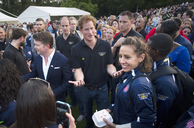 Britain’s Prince Harry (center) attends the Invictus Games welcome reception hosted by U.S. Ambassador Matthew Barzun (center left) at the residence of the U.S. ambassador in London on Tuesday.   AP-Yonhap