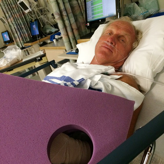 This photo provided by Greg Norman shows Norman resting in a hospital bed after a chainsaw accident.   AP-Yonhap