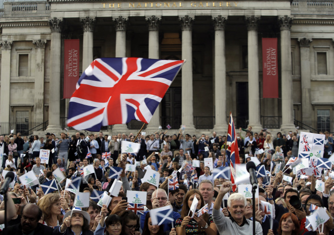 Supporters wave British and Scottish flags at a pro-union rally at Trafalgar Square in central London on Monday.   AP-Yonhap