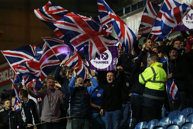 Pro-union Rangers supporters wave flags in Ibrox Stadium prior to the Scottish League Cup match between Rangers and Inverness in Glasgow on Tuesday, ahead of the Scottish independence referendum on Thursday.   AFP-Yonhap