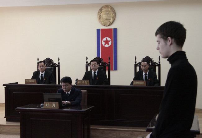 Matthew Miller, a U.S. citizen, stands during his trial at the Supreme Court in Pyongyang, North Korea, on Sunday.  (AP-Yonhap)